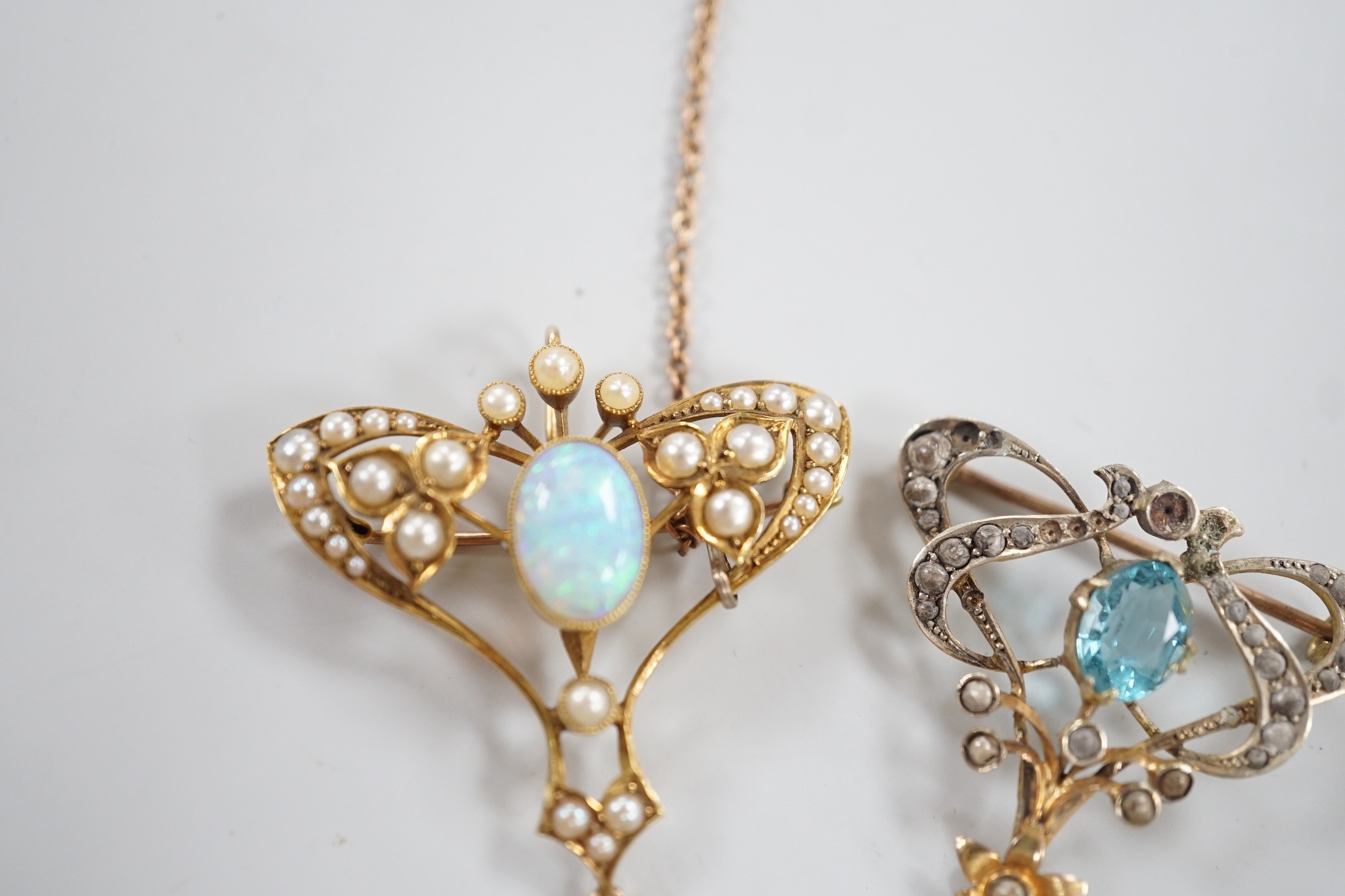 An Edwardian 15ct, white opal and seed pearl cluster set drop pendant brooch, 41mm, gross weight 5.8 grams and one other 9ct gem set drop brooch(a.f.), gross 4.2 grams.
